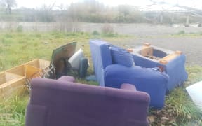 Dumped furniture, near the Waiohine River, near State Highway 2, between Greytown and Carterton. Two Wairarapa district councils, Greater Wellington Regional Council, and NZTA all said clearing the furniture was not their problem, before Carterton council workers cleared up the mess.