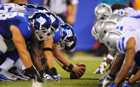 NFL rivals the New York Giants line up against the Dallas Cowboys.