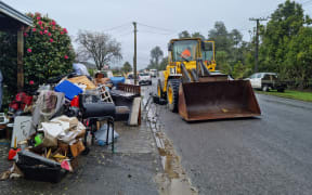 The New Zealand Defence Force, Buller District Council staff and Westreef contractors are working together to remove flood damaged items from homes in Westport.