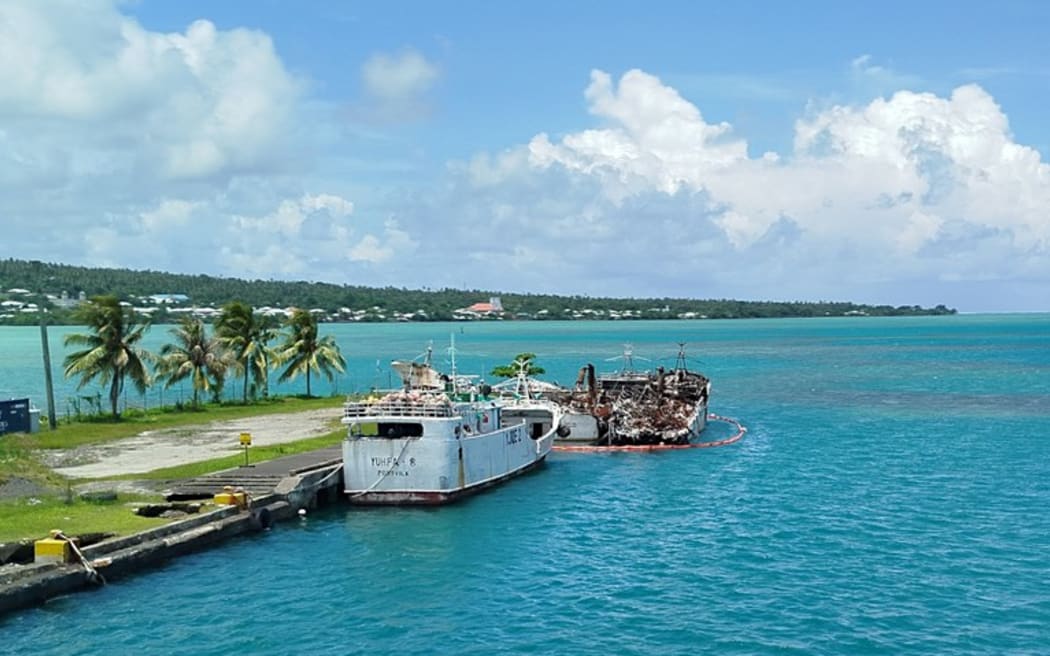 The remains of two of three seized fishing boats destroyed by fire in November and with a fourth afloat at Salelologa Wharf in Savaii, Samoa. Pictured Jan. 26, 2025. (Tausivaatele Peter)