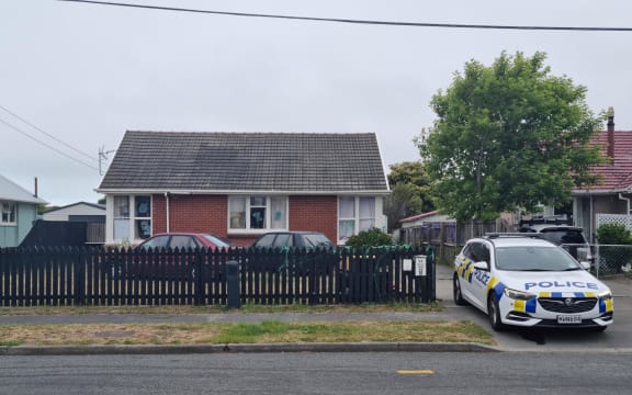 Police have raided two properties near the site of a stabbing at Bexley Park in Christchurch that left a man critically injured on 14 November.
