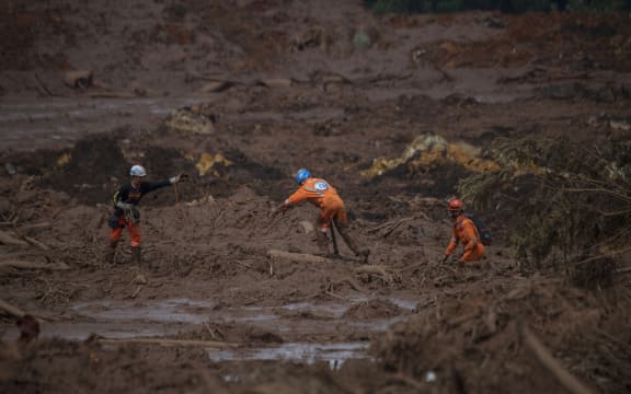 Rescuers search for vicitms in the mud-hit community of Casa Grande two days after the collapse of a dam at an iron-ore mine belonging to Brazil's giant mining company Vale near the town of Brumadinho, state of Minas Gerias, southeastern Brazil, on January 27, 2019.