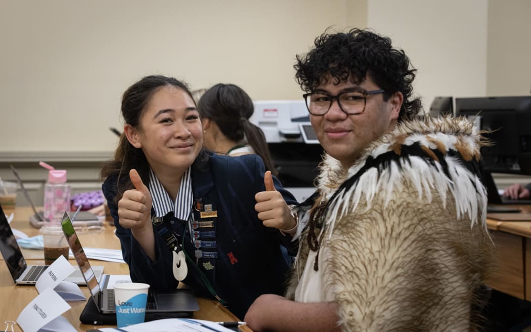 Grace Pickering and Thomas Tito-Green take a short break between witnesses in a youth select committee hearing.