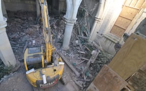 Remote operated digger clears debris in the Christchurch Cathedral