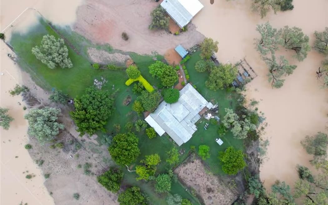 A rural property in western Queensland completely surrounded by water.