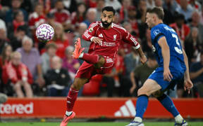 Liverpool's Egyptian striker Mohamed Salah crosses the ball against Bournemouth.