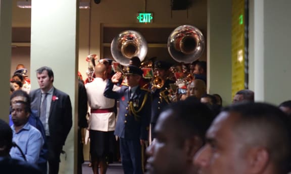 The military band was instead relegated to a tight corner at the back of the lecture theatre.