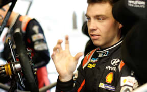 Haydon Paddon discusses fine tuning his car during the Rally of Finland.