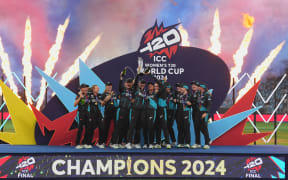 New Zealand White Ferns team celebrates with the trophy, ICC Women's T20 World Cup Final, Dubai, 2024.