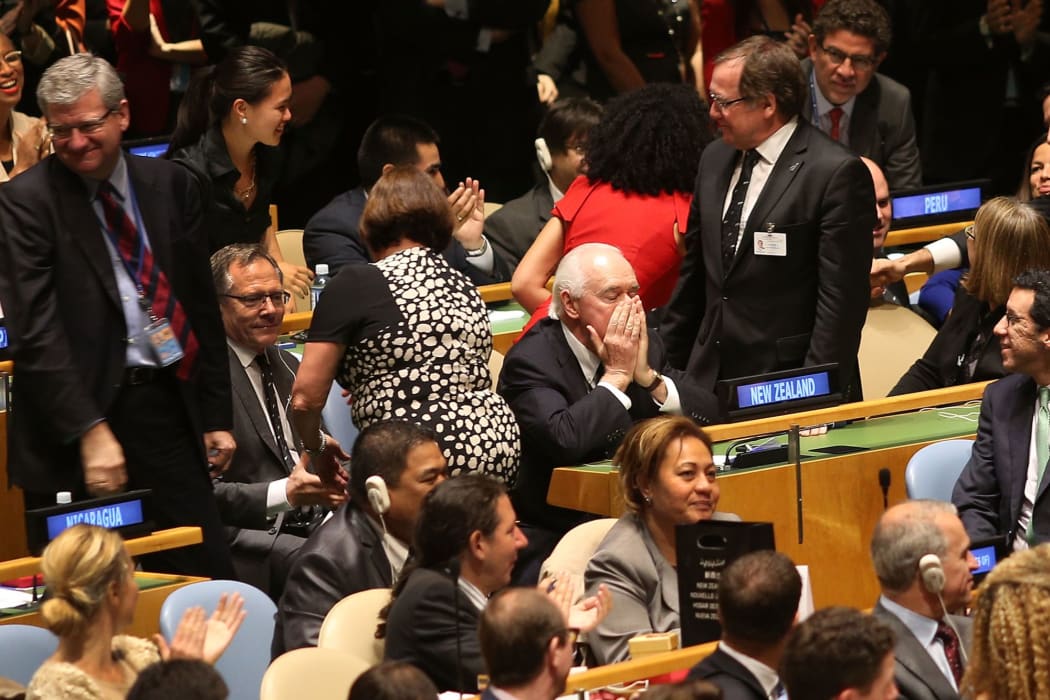 New Zealand's Jim McLay (centre) reacts after New Zealand was elected as a non-permanent member of the Security Council.