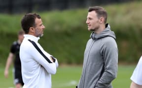 Anthony Hudson and Tommy Smith talk at All Whites training.