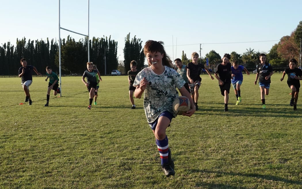 Aotearoa’s Next Top Mullet winner Ted Keen training with the Kerikeri Rugby Club Under-11s.