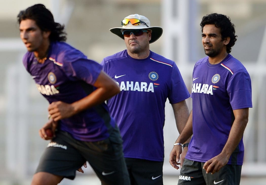 India bowler Ishant Sharma watched by bowling coach Joe Dawes and teammate Zaheer Khan during a training session in 2012.