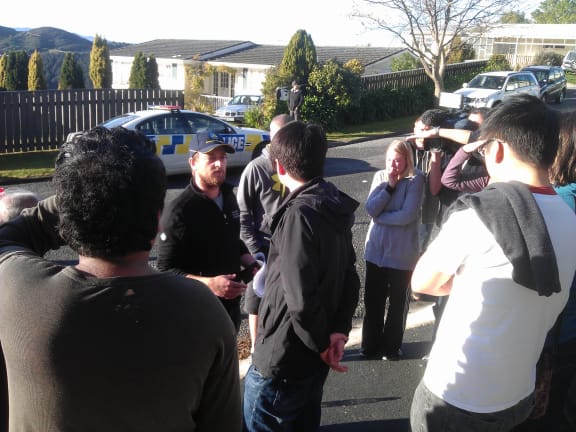 Police brief residents about when they may return to their homes.