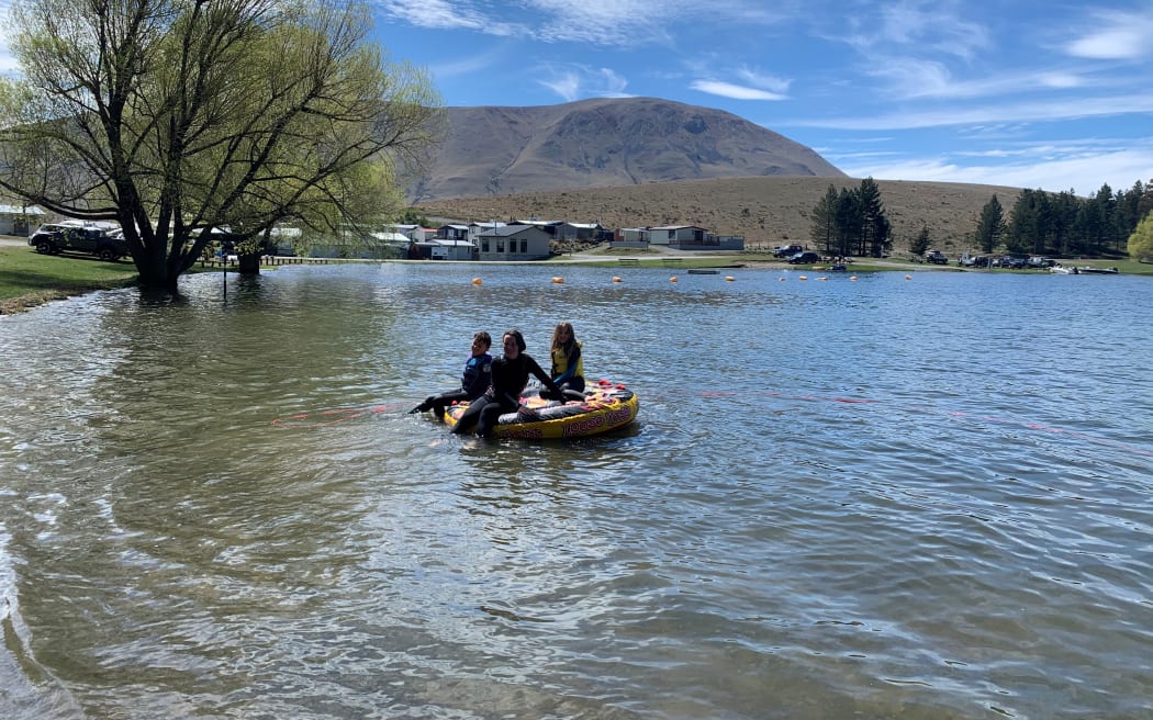 Vanessa Wright’s kids swimming in Lake Camp in October 2021, when the water level was much higher.