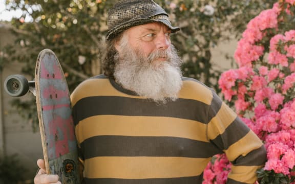 older man with skateboard