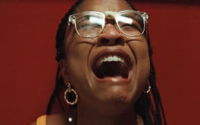 Movie still from the 2023 horror film The Angry Black Girl and Her Monster