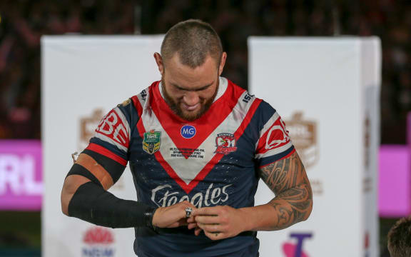 Jared Waerea-Hargreaves looks at his premiership ring.