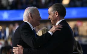 (FILES) US President Joe Biden and his son Hunter Biden hug on stage at the conclusion of the first day of the Democratic National Convention (DNC) at the United Center in Chicago, Illinois, on August 19, 2024. - US President Joe Biden on December 1, 2024 said he had issued an official pardon for his son Hunter, who is facing sentencing for two criminal cases related to tax evasion and the purchase of a firearm. "No reasonable person who looks at the facts of Hunter’s cases can reach any other conclusion than Hunter was singled out only because he is my son -- and that is wrong," the president said in a statement, calling it "a miscarriage of justice." (Photo by Brendan SMIALOWSKI / AFP)