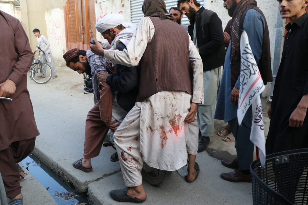 Wounded people are dispatched to hospitals after a bomb exploded in a mosque in the Afghan capital Kabul during Friday prayers on 29 April 2022.