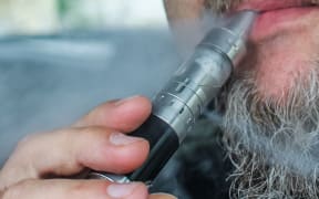Man vaping while driving a car is seen in Gdansk, Poland on 9 July 2019