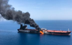 Smoke billows from Norwegian-owned Front Altair tanker in the Gulf of Oman.(Picture obtained by AFP from Iranian News Agency ISNA on 13 June, 2019).