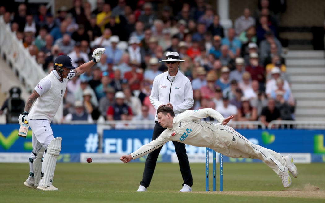 Black Caps bowler Michael Bracewell dives for a ball.