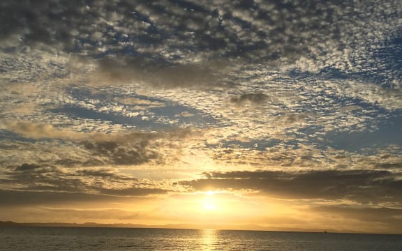 Cloudy sunrise on Eastern Beach, Auckland New Zealand