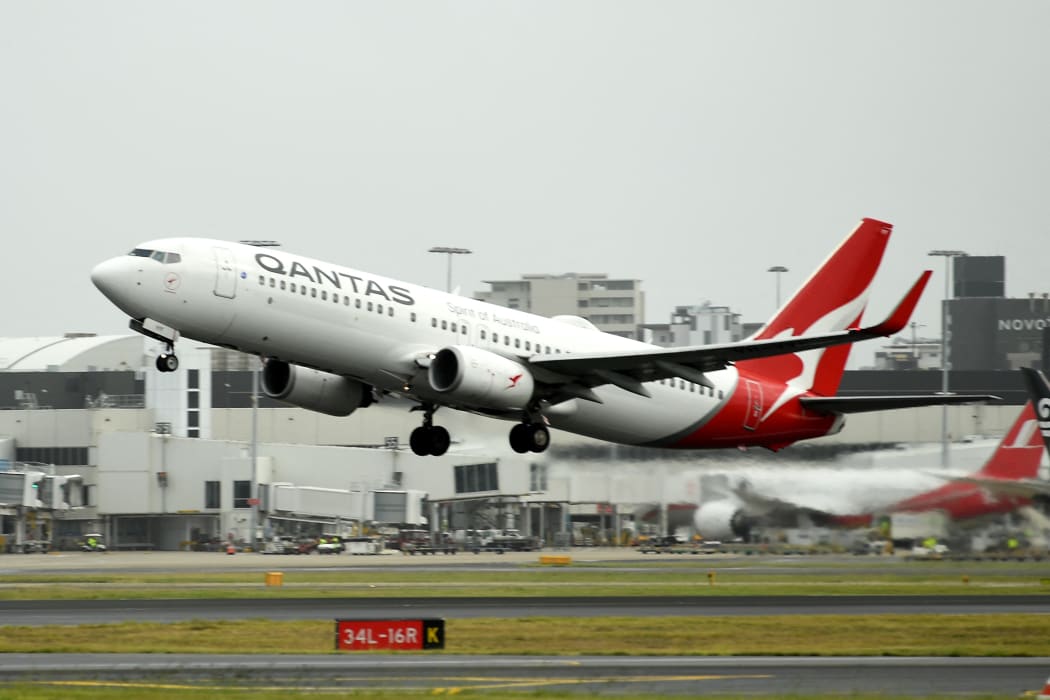 A Qantas plane takes off from the Sydney International airport on 6 May 2021.