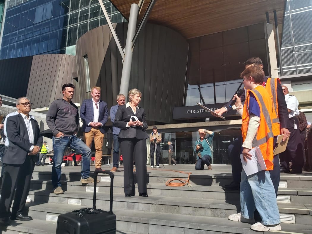 Demands are delivered to Christchurch Mayor Lianne Dalziel. As she says change is needed, there are calls of "what are you going to do" from the crowd.