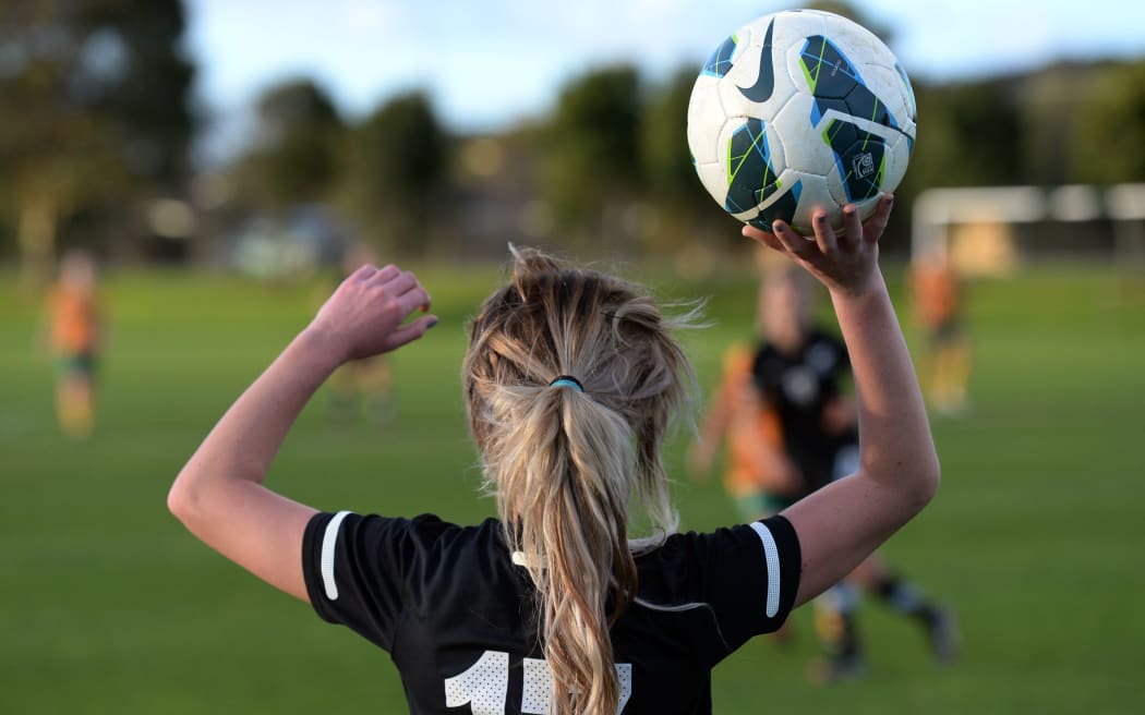 Laura Merrin, who now plays for Everton, prepares to take a throw-in for the Junior Ferns against the Young Matildas at Kristin School in Albany, Auckland, back in July 2013. Photo: Andrew Cornaga / Photosport.co.nz