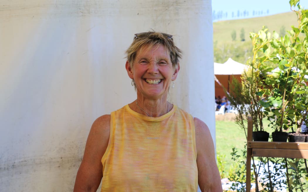 Jules Matthews smiles directly at the camera