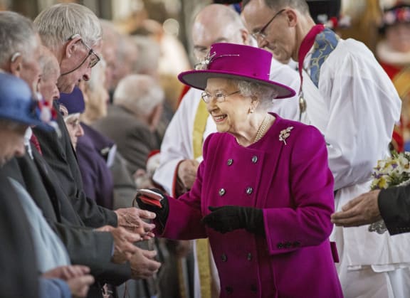 The Queen distributes Maundy money during a Royal Maundy Service at Blackburn Cathedral.