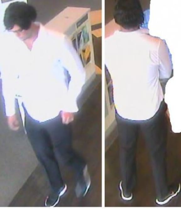 The man disguised himself in a black wig and black-rimmed glasses