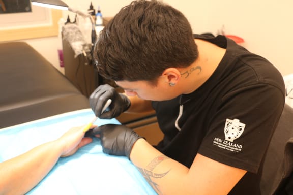 Jacob Tautari is one of the resident moko artists at the new space at NZMACI.