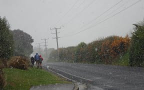 Dunedin locals caught out in a brief snow storm. 28 September 2020