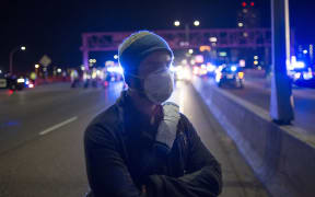 Police block protesters of President-elect Donald Trump from marching after they blocked traffic on I-94 in Minneapolis, Minnesota.