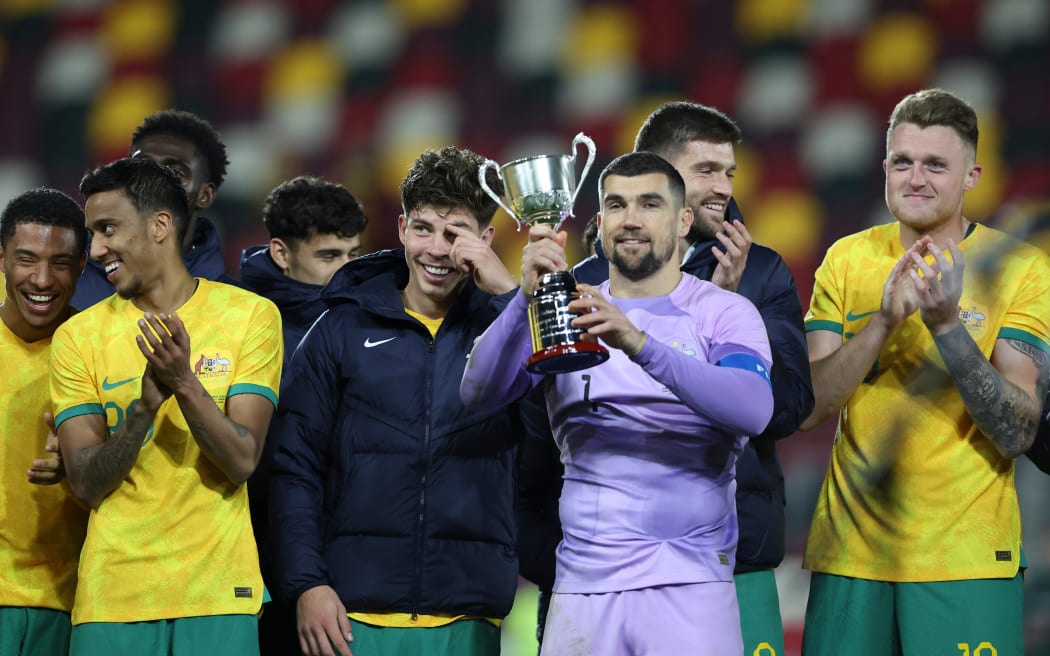 Australian captain Mat Ryan with the Soccer Ashes Trophy.