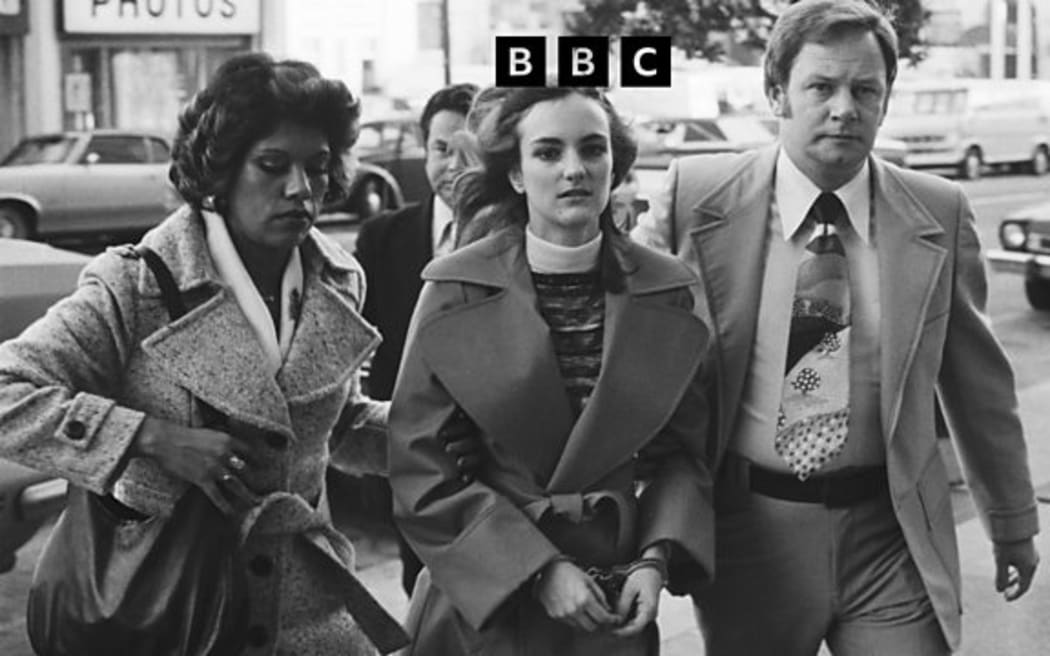 Patty being led to her trial