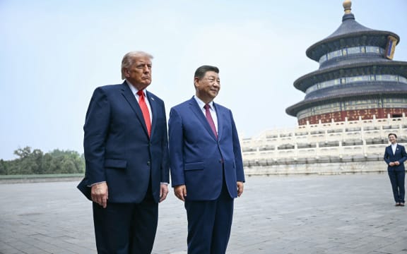 China's President Xi Jinping (R) and US President Donald Trump visit the Temple of Heaven in Beijing on May 14, 2026. Xi warned Trump that the issue of Taiwan could push their two countries into 