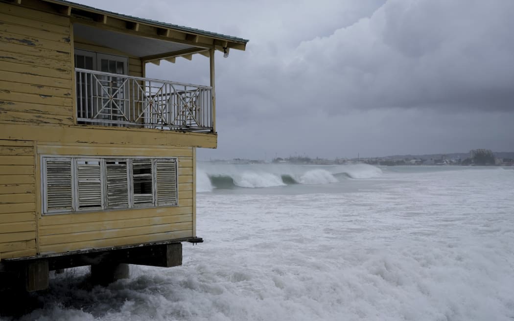 Waves batter a pier during the pass of Hurricane Beryl in Bridgetown, Barbados, July 1, 2024. (AP Photo/Ricardo Mazalan)