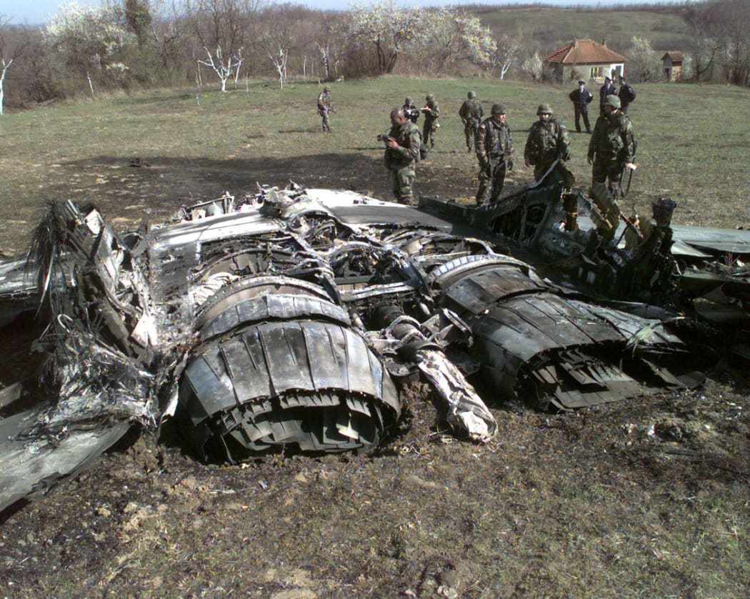 A U.S. Army documentation team surveys the wreckage of a Former Republic of Yugoslavia MiG-29 Fulcrum jet fighter which was shot down by NATO forces in March 1999 outside the town of Ugljevik, Bosnia and Herzegovina.