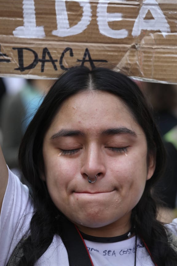 "Dreamer" Gloria Mendoza, 26, tries to hold back tears after learning that President Trump had ended the DACA program on September 5, 2017 in New York, United States. Mendoza, who said she came with her undocumented parents from Mexico City when she was 9, will face possible deportation.