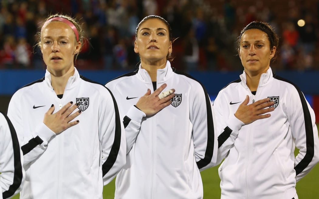 Becky Sauerbrunn #4, Hope Solo #1 and Carli Lloyd #10 of the United States women's team before a match against Costa Rica.