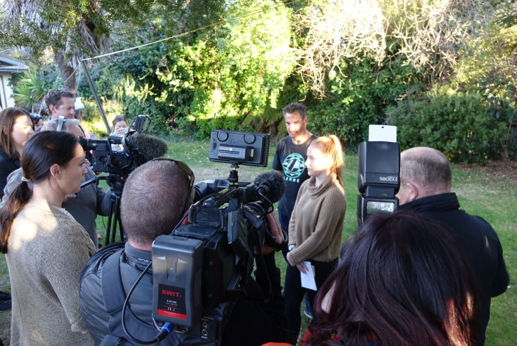 Napier teenage Anela Pritchard and father Andrew speak to reporters in their backyard