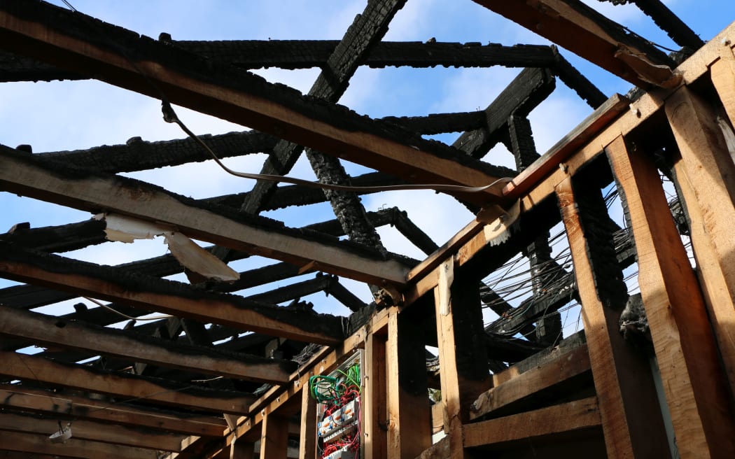 Ms Scott and her partner's home damaged by a fire that happened on their first night in the house.
