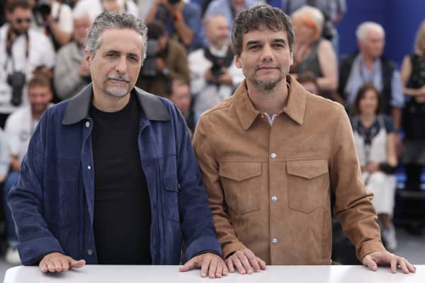 Brazilian director and screenwriter Kleber Mendonca Filho and Brazilian actor Wagner Moura pose during a photocall for the film "O Agente Secreto" (The Secret Agent) at the 78th edition of the Cannes Film Festival in Cannes, southern France, on May 19, 2025. (Photo by Valery HACHE / AFP)