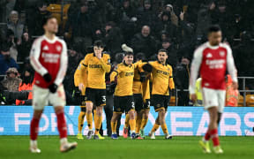 Wolverhampton Wanderers players celebrate a goal against Arsenal.