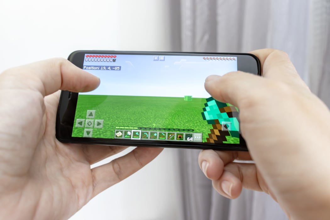 A smartphone with online multiplayer game Minecraft.