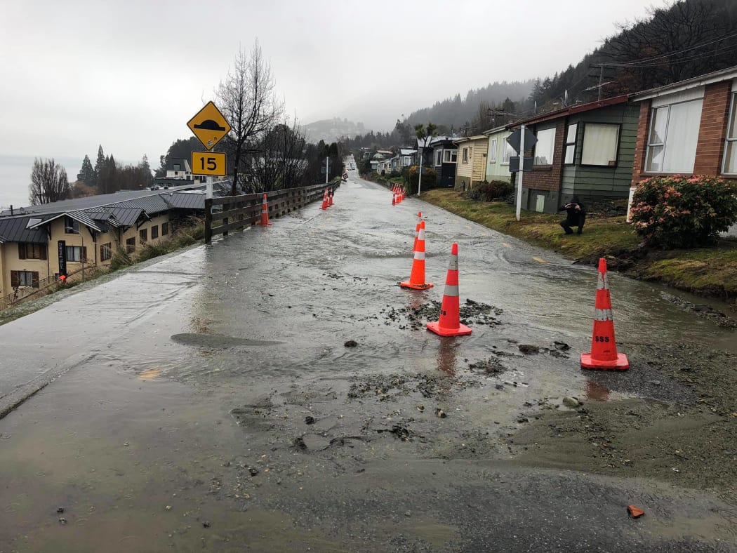 Burst water main floods Queenstown street.